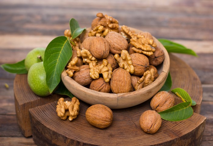 Walnuts in a Bowl with Green Apples