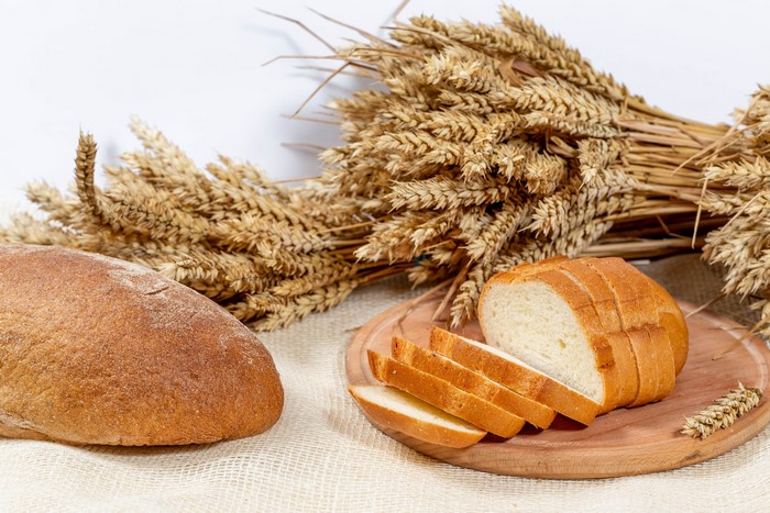 Bread and wheat stalks on a table