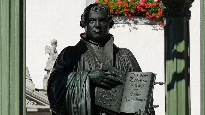 Bronze statue of Martin Luther holding a book