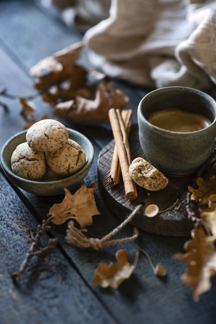 Coffee, Cookies, and Cinnamon Sticks on Wood