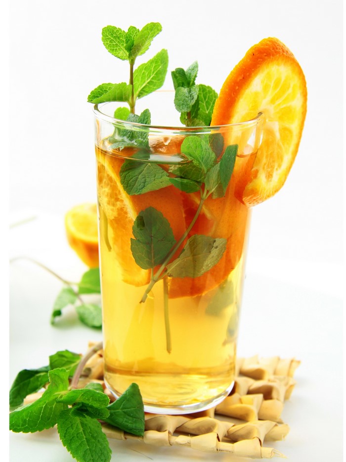 Orange and mint iced tea in a highball glass