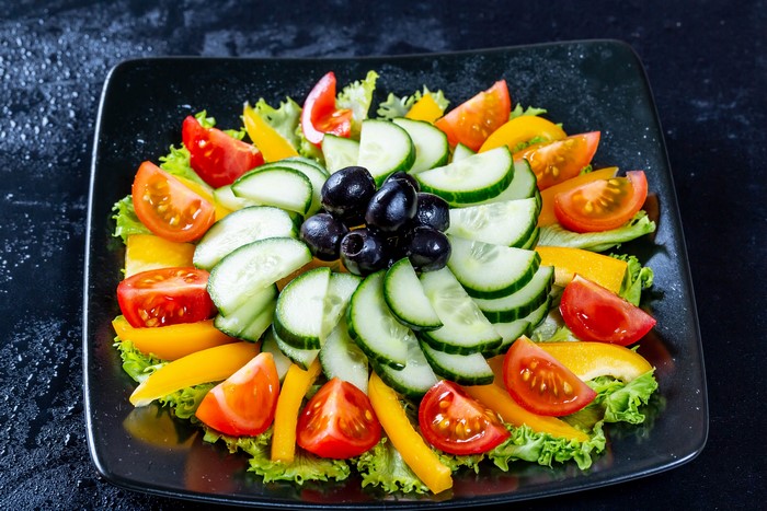 Vegetable salad with olives, cucumbers, and tomatoes