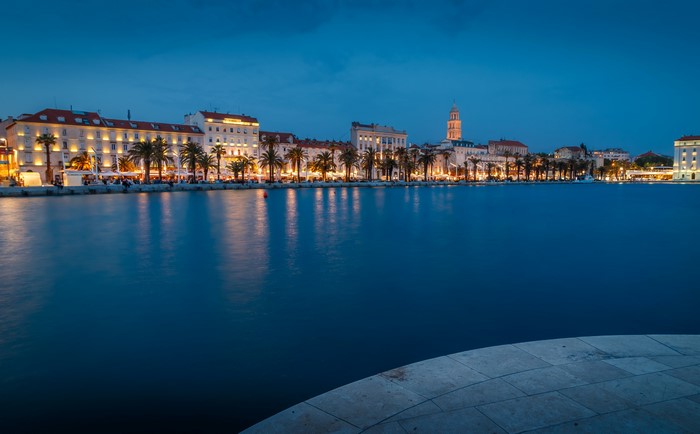 City of Split waterfront at dusk with palm trees