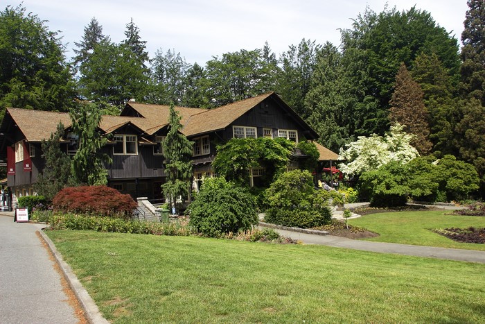 Stanley Park House with Trees and Lawn in Vancouver