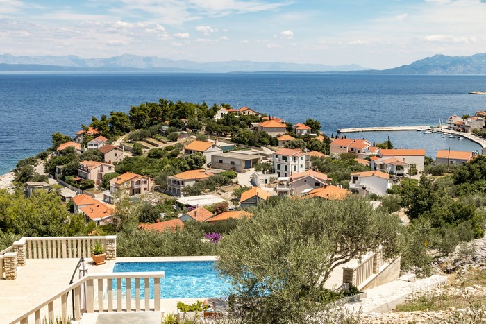 Houses on a hill overlooking the sea in Prigradica, Croatia