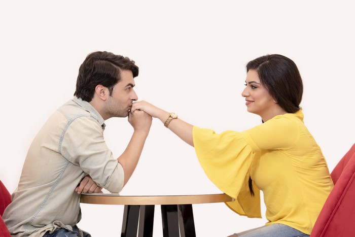 Couple in love, man kissing woman's hand