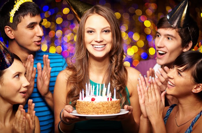 Birthday celebration with cake and friends