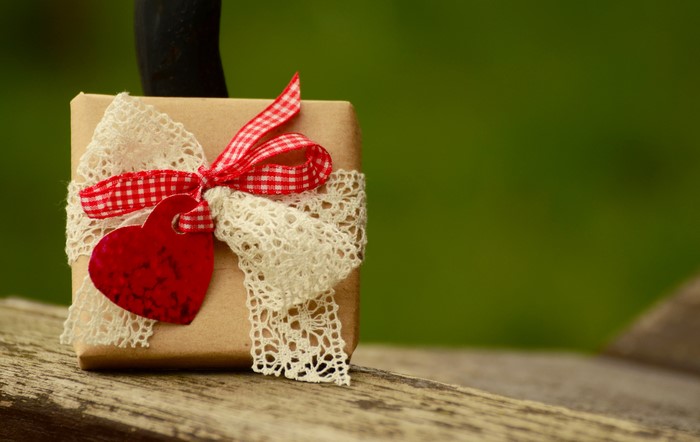 Gift with red ribbon and heart