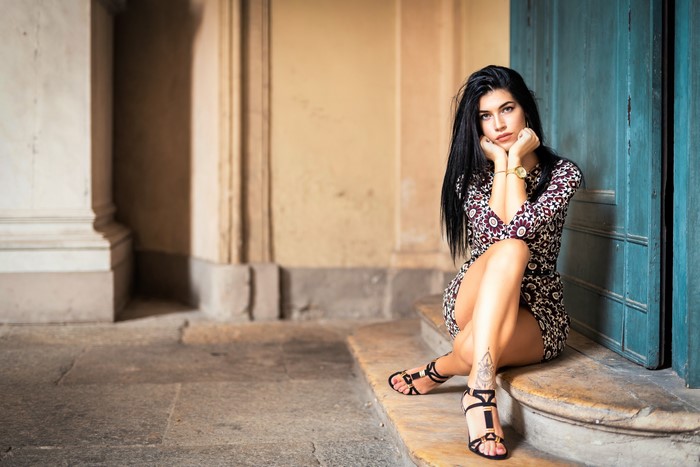 Brunette girl sitting on steps