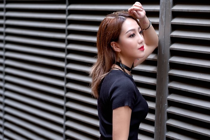 Asian woman with brown hair posing