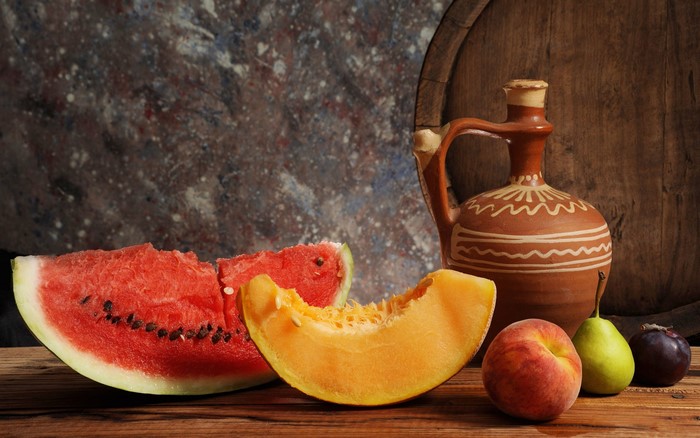 Still-life with watermelon, melon, peach, pear, plum, and jug