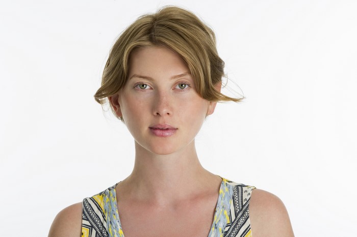 Woman with blonde hair on white background