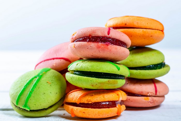 Stack of colorful macarons with jam filling