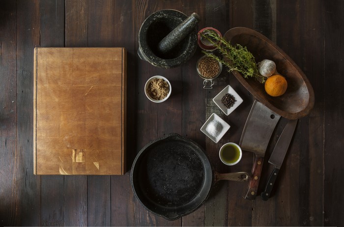 Ingredients and cooking tools on a wooden table