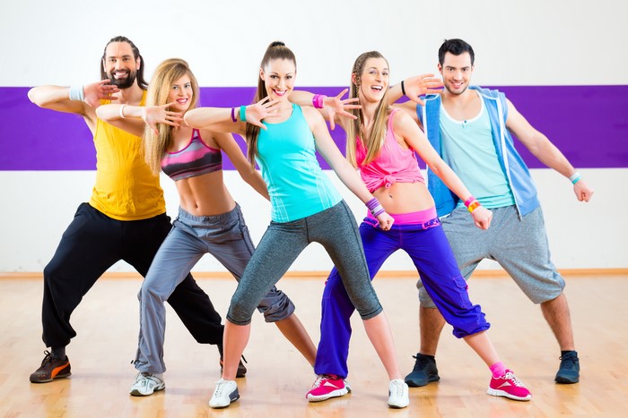 Group of people dancing in a studio