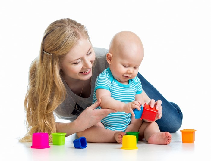 Mother and Baby Playing with Colorful Toys