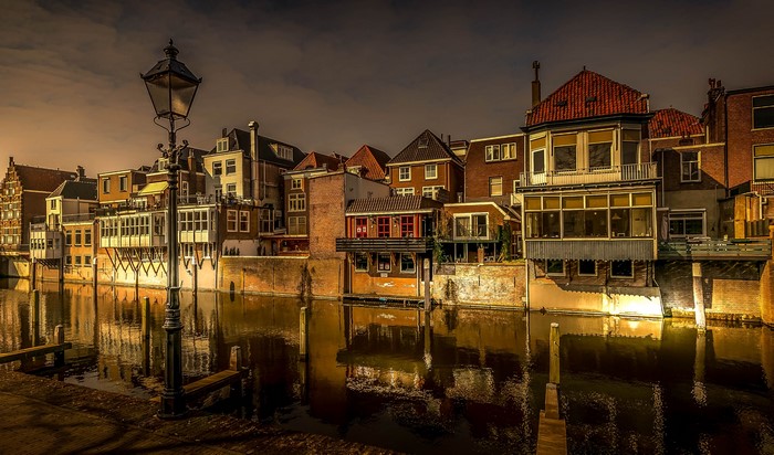 Houses along a canal in Gorinchem, Netherlands at dusk