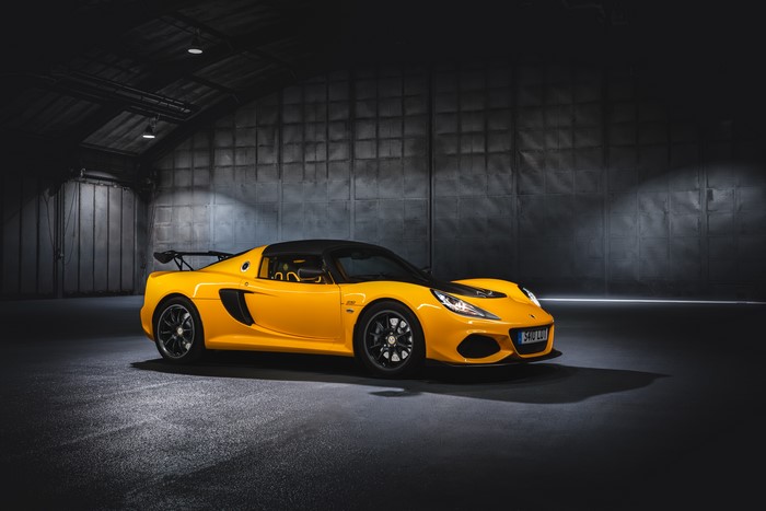 Yellow Lotus Exige Sport 410 in a dark garage