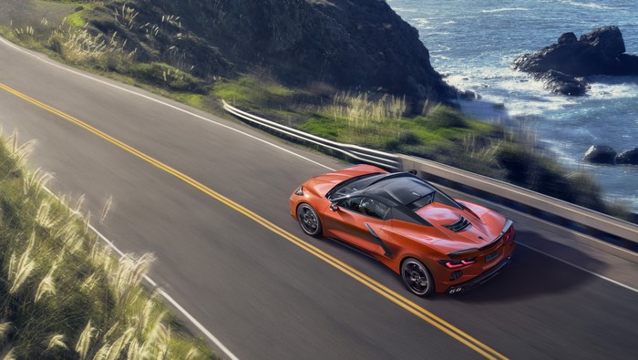 Orange Chevrolet Corvette C8 Stingray Convertible on Coastal Road