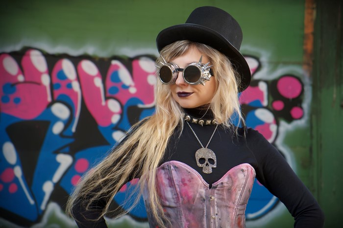 Steampunk girl with skull necklace and hat