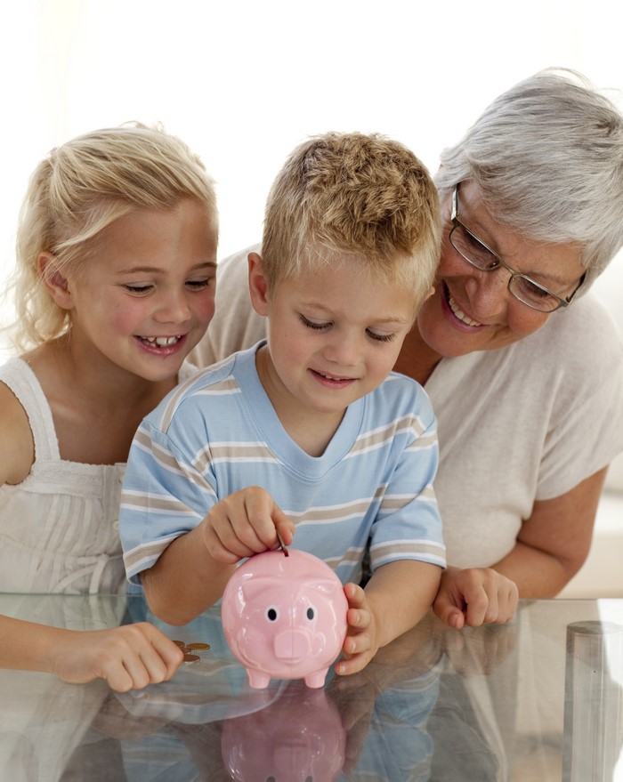 Children and Grandmother with Piggy Bank