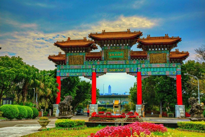 Traditional Chinese Gate with Flowers and Sculptures