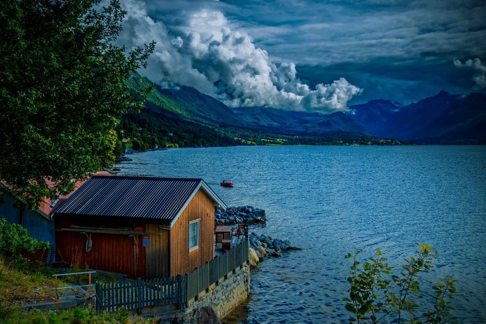 Wooden houses by a lake in Isfjorden, Norway
