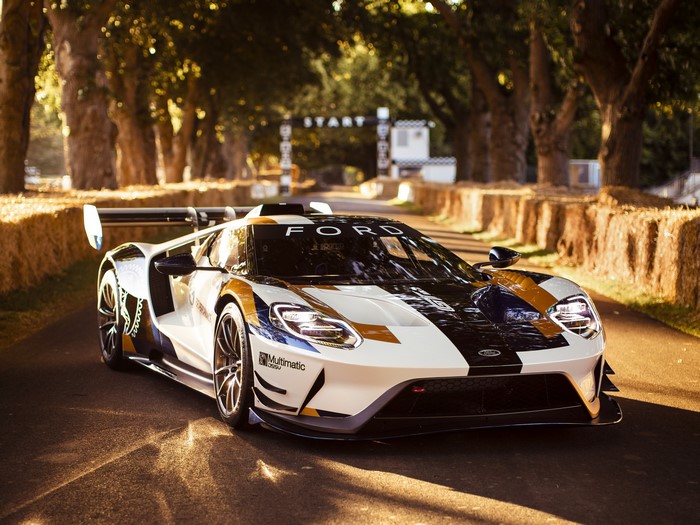 Ford GT Mk II race car on a tree-lined track