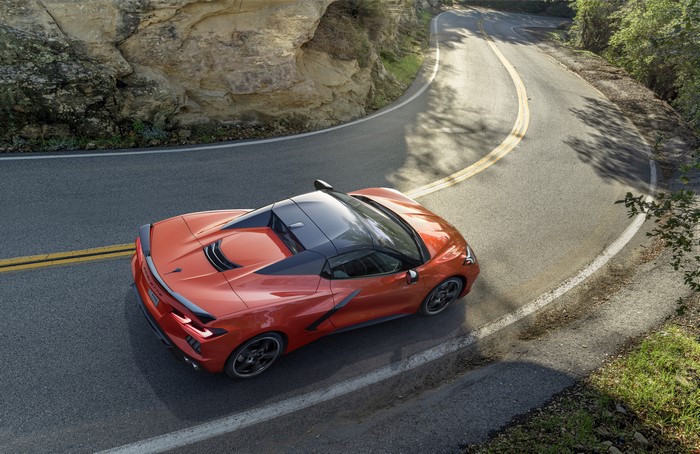 Orange Chevrolet Corvette Stingray C8 on a Winding Road