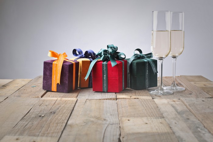 Gifts and Champagne Glasses on Wood Planks
