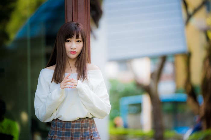 4K Asian Woman with Brown Hair in Bokeh Setting