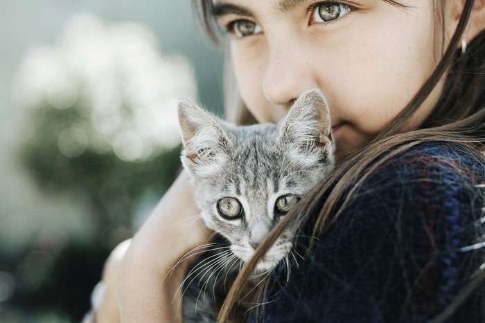 Girl holding a kitten