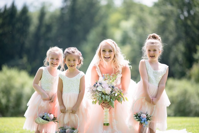 Bride and flower girls with bouquets