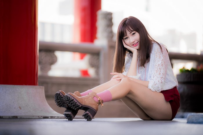 4K Portrait of Brown-Haired Woman Sitting with Boots