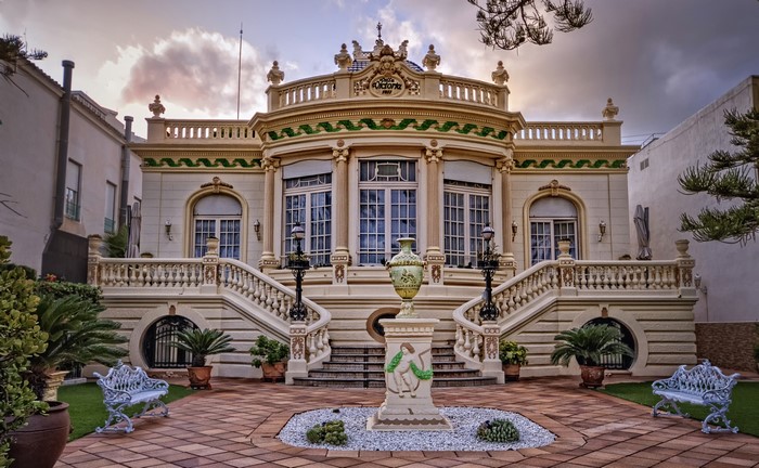 Villa Victoria with ornate stairs and garden in Spain