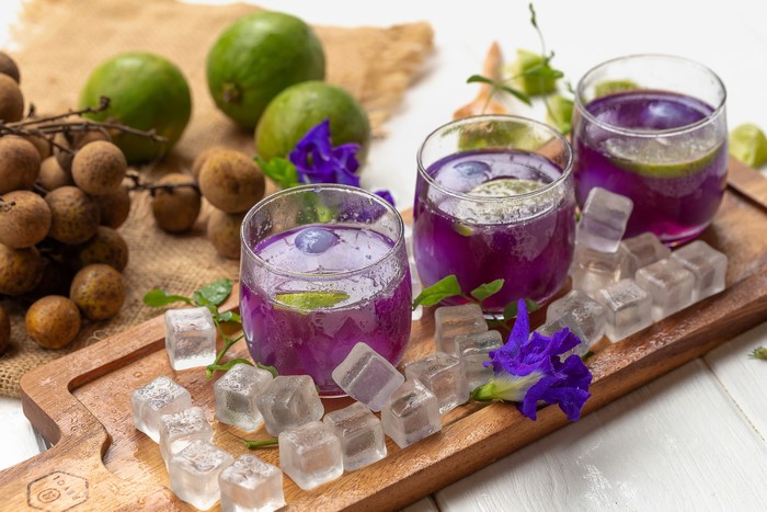 Purple drinks with longan, lime, and ice