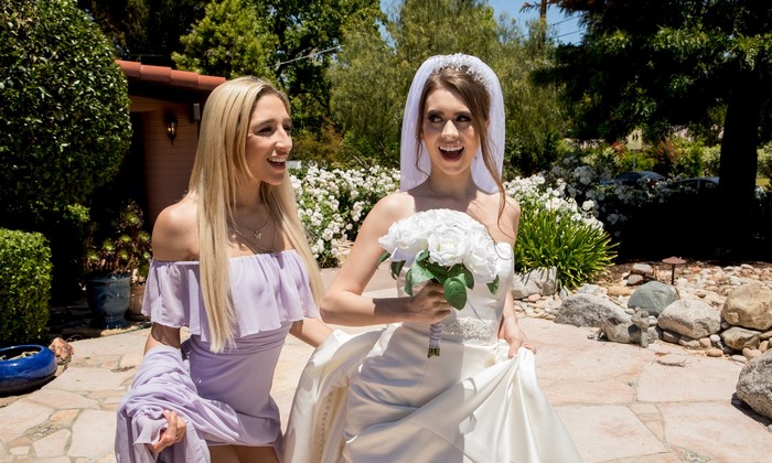 Bride and blonde woman with bouquet