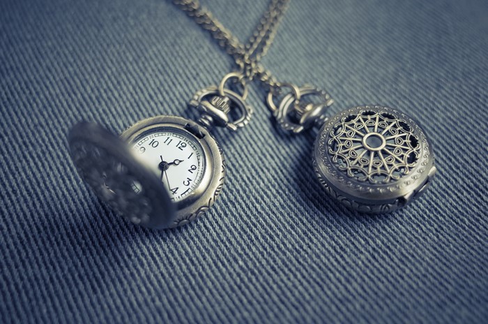 Two pocket watches on a chain
