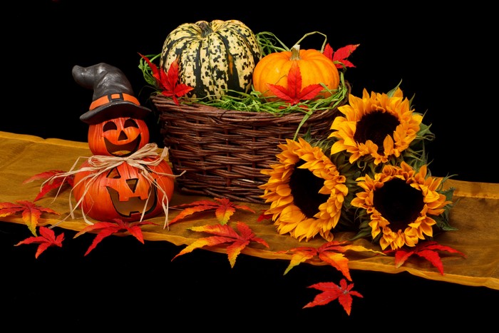 Halloween Pumpkins, Sunflowers, and Autumn Leaves in a Basket