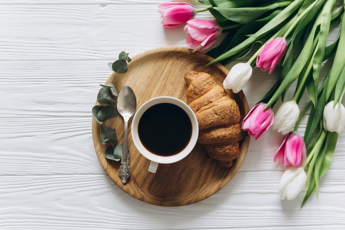 Coffee, Croissant, Spoon, Eucalyptus, and Tulips on a Tray