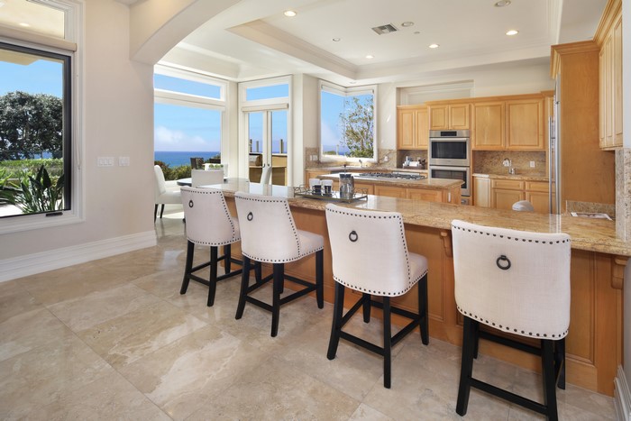 Kitchen with ocean view and bar stools