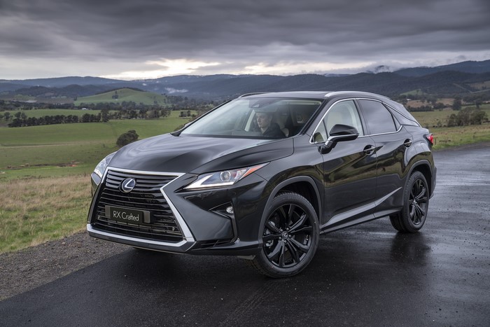 Black Lexus RX 350 Crafted SUV on a Wet Road