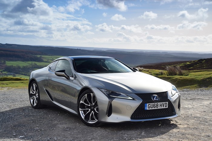 Silver Lexus LC 500h parked on a gravel road