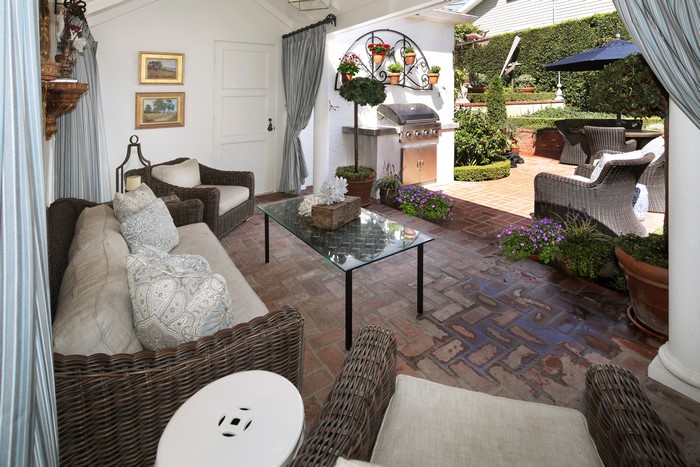 Outdoor living room with grill and patio furniture