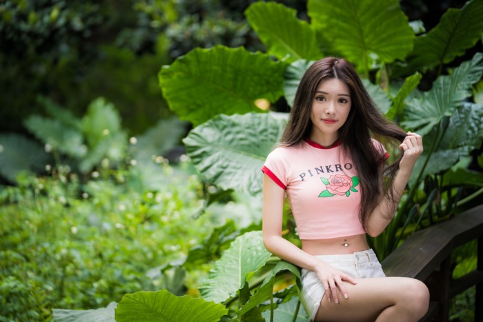 4K Asian Woman with Long Hair in Greenery