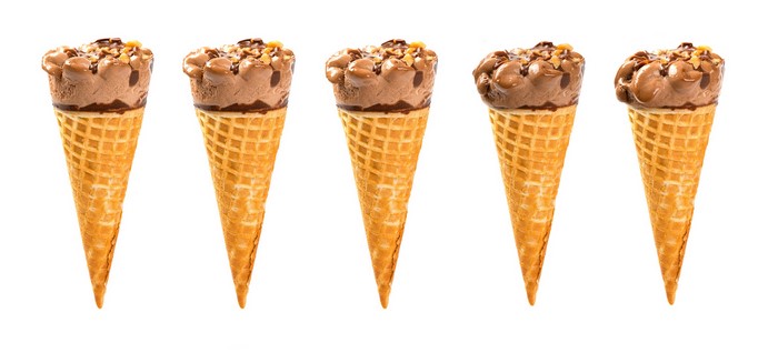 Five chocolate ice cream cones with nuts