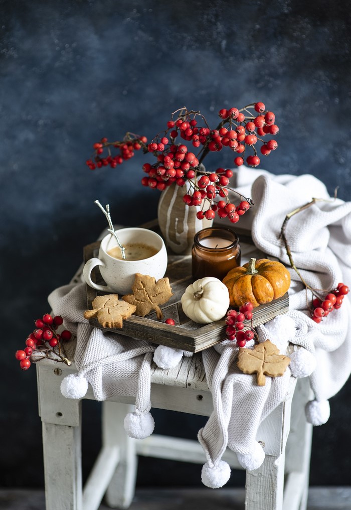 Autumn still life with coffee, cookies, and pumpkins