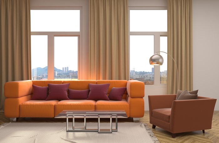 Orange Sofa and Armchair in Living Room with City View
