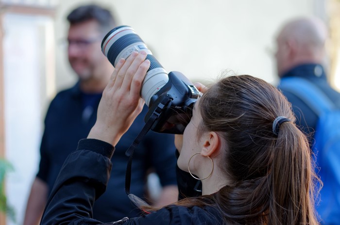 Woman with Camera and Long Lens