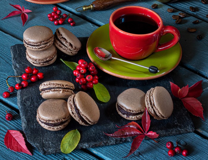 Chocolate macarons with coffee and berries